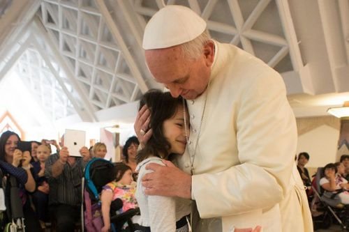 Pope Francis with a group of disabled children