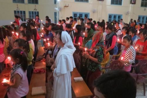 Faithful in India's Miao diocese pray in a candlelight vigil for persecuted Christians in the Middle East