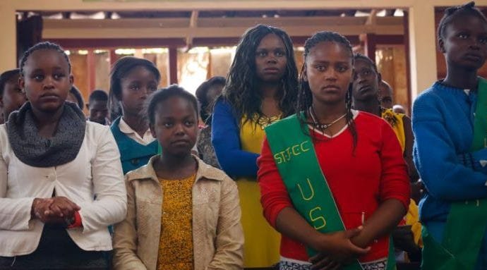 Young people pray during Mass in 2015 at St. Joseph the Worker Catholic Church in Nairobi