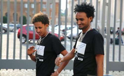 Survivors and family members of the migrants who perished in an Oct. 3