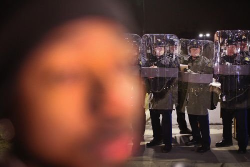 Police and protesters await the grand jury announcement in the Michael Brown case Nov. 24