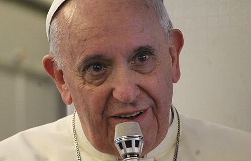 Pope Francis speaks with journalists on the papal plane August 18