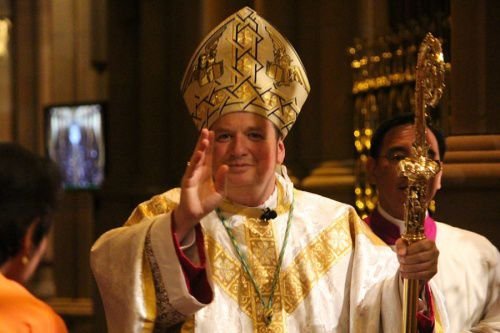 Archbishop Anthony Fisher of Sydney blesses as he recesses from his Mass of Installation