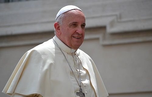 Pope Francis greets pilgrims in St. Peter's Square after the Wednesday general audience on May 7