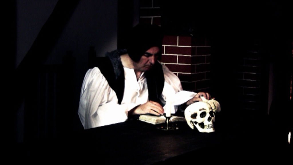 Saint John Fisher in prayer and meditation in a screenshot from 'Saint John Fisher' (¬© 2012 Mary's Dowry Productions