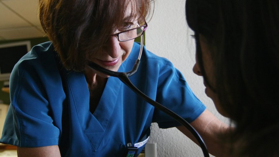 A nurse listens to the heartbeat of an unidentified woman at St. Joseph's Hospital and Medical Center in Phoenix. (CNS photo/J.D. Long-Garcia, The Catholic Sun)