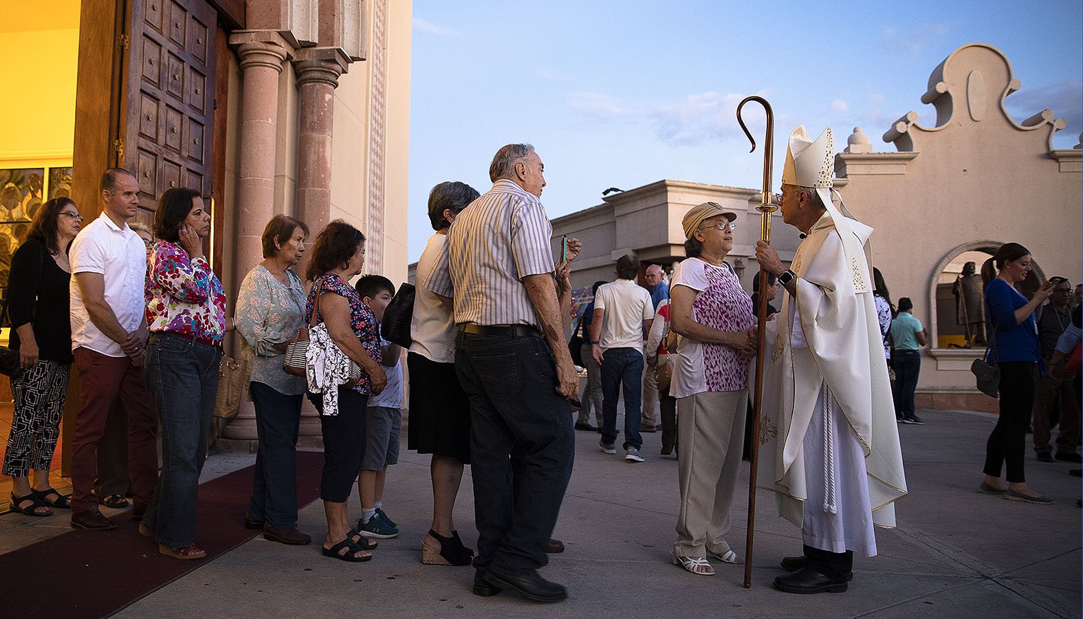 Bishop Mark J. Seitz of El Paso, Texas, greets people after Mass at St. Pius X Church in El Paso Sept. 23, 2019, during a pastoral encounter by U.S. bishops with migrants at the border. The Sept. 23-27 pastoral visit, sponsored by various offices of the U.S. Conference of Catholic Bishops and other national organizations, aimed to highlight the church's ministry to migrants, the border conditions and immigration laws affecting them, and their material and spiritual needs. (CNS photo/Tyler Orsburn)