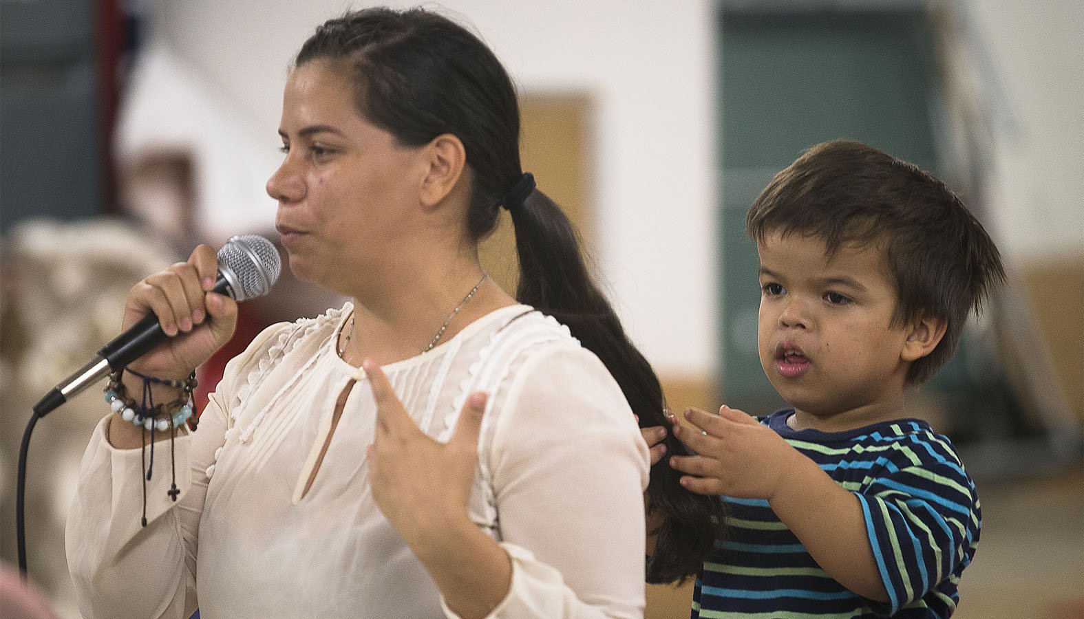 Ingrid, seen with her son, shares her immigration story about coming north from Nicaragua at Corpus Christi Church in Ciudad Juarez, Mexico, Sept. 24, 2019. Her talk was part of a pastoral encounter by U.S. bishops with migrants at the border. The Sept. 23-27 pastoral visit, sponsored by various offices of the U.S. Conference of Catholic Bishops and other national organizations, aimed to highlight the church's ministry to migrants, the border conditions and immigration laws affecting them, and their material and spiritual needs. (CNS photo/Tyler Orsburn)