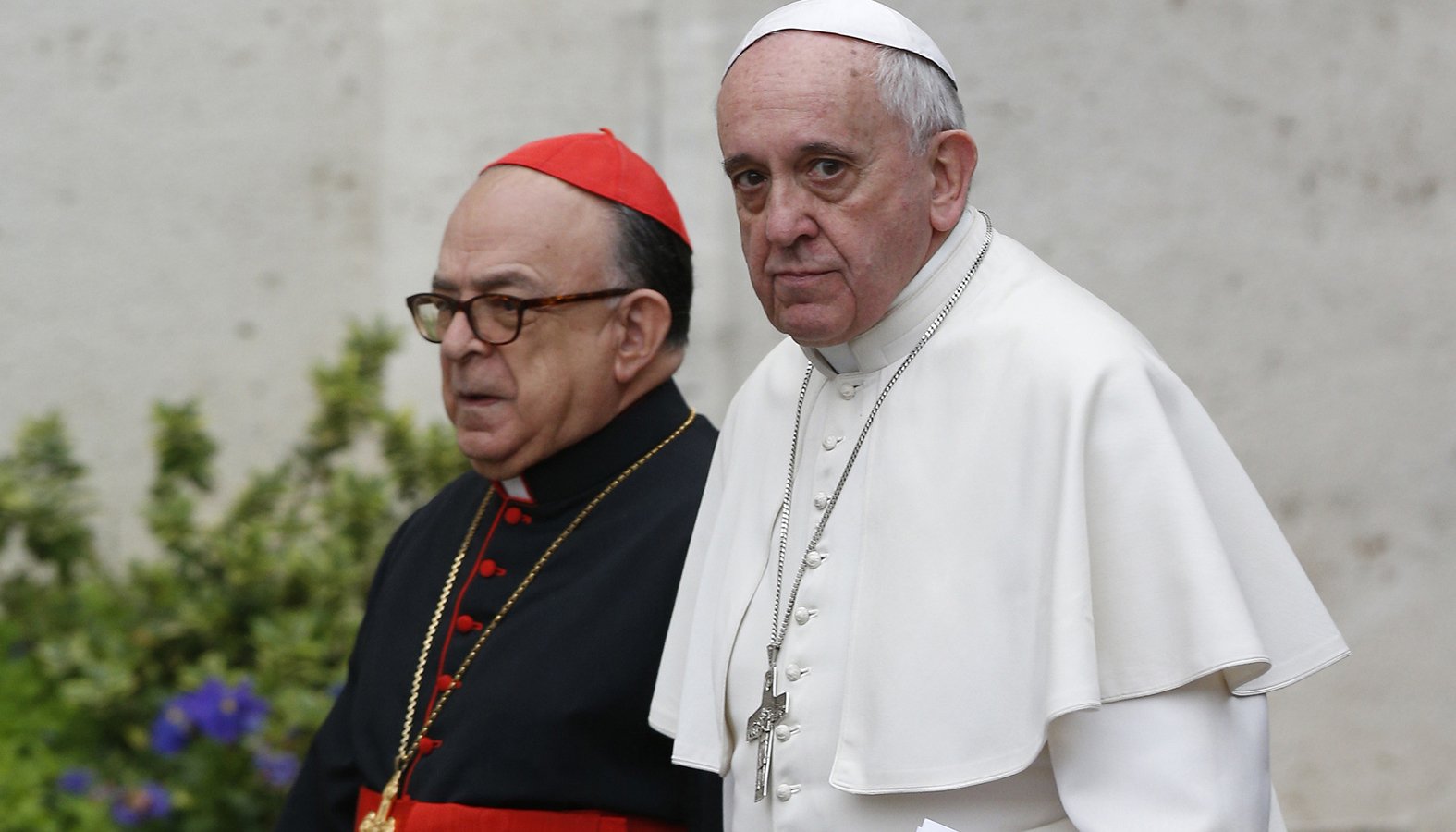 Pope Francis and Cardinal Raymundo Damasceno Assis of Aparecida, Brazil, walk to a meeting of cardinals in the synod hall at the Vatican Feb. 20, 2014. In a statement released by the Vatican Sept. 28, 2019, the pope named Cardinal Damasceno as pontifical commissioner of the Heralds of the Gospel and its religious branches for consecrated men and women. (CNS photo/Paul Haring)