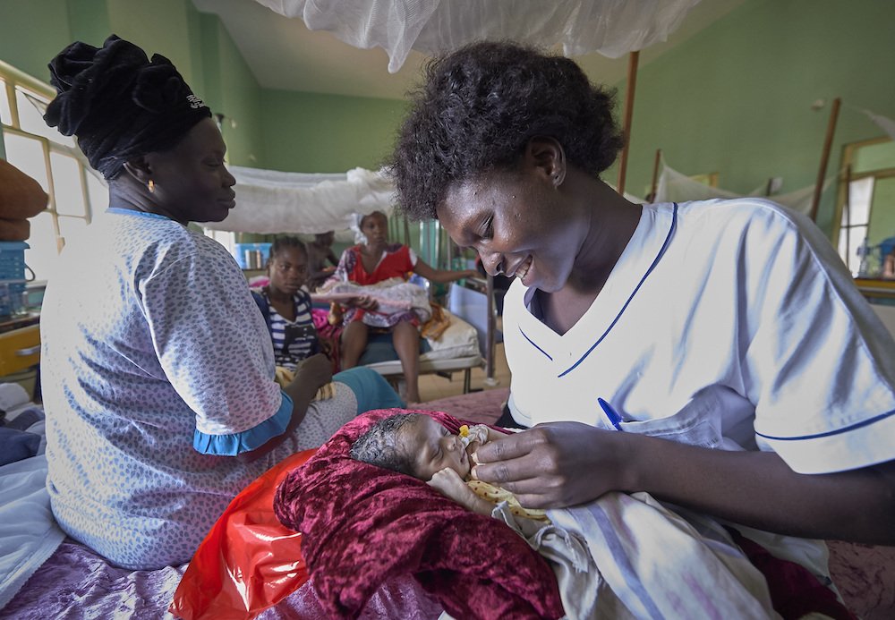 Nurse Annet Kojo feeds a 4-day-old baby girl in the maternity ward of the St. Daniel Comboni Catholic Hospital in Wau