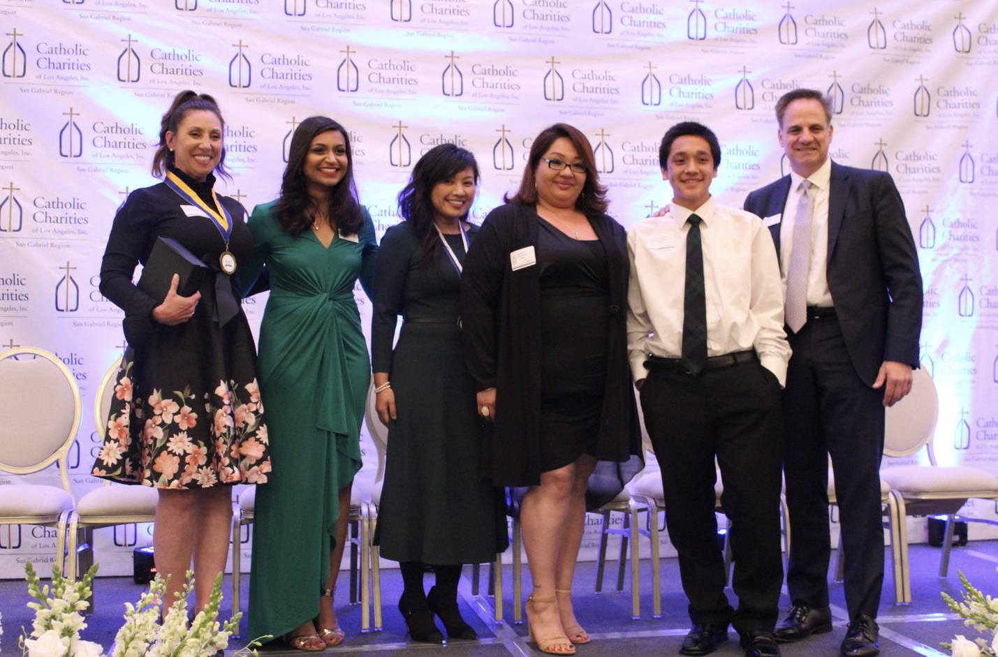 Pomona Catholic representatives accept the Spirit of Caring Award. (PHOTO COURTESY POMONA CATHOLIC SCHOOL)