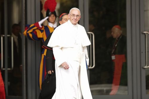 Pope Francis walking out of the Paul VI Hall during the Synod on the Family