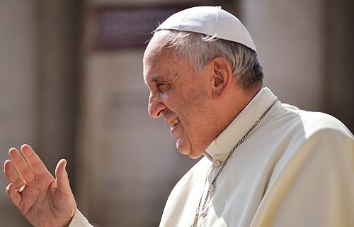 Pope Francis greets pilgrims in St. Peter's Square during his Wednesday general audience on June 18