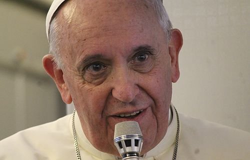 Pope Francis speaks with journalists on the papal plane on the return flight to Rome August 18
