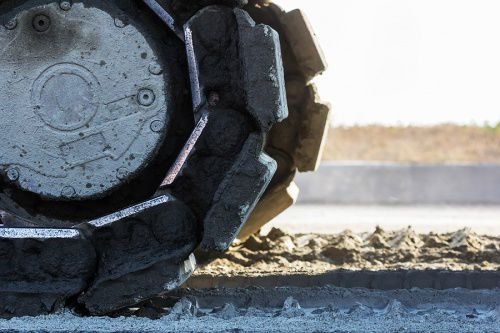 Bulldozer tracks. Credit: TUM2282 via www.shutterstock.com.