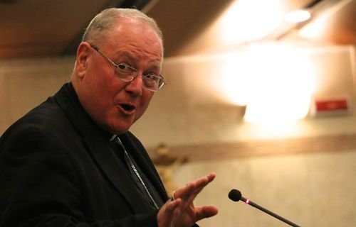 Cardinal Timothy Dolan of New York speaking during the communications conference at Rome's Pontifical University of the Holy Cross