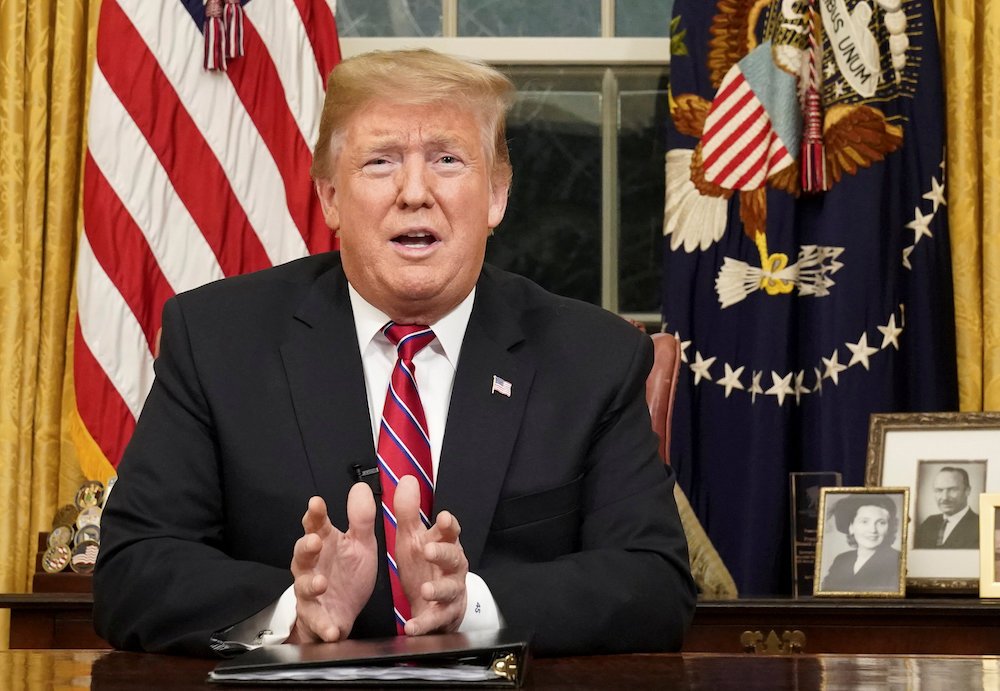 U.S. President Donald Trump delivers an address Jan. 8 televised to the nation from his desk in the Oval Office at the White House in Washington. He spoke about immigration and the southern U.S. border on the 18th day of a partial government shutdown. (CNS photo/Carlos Barria