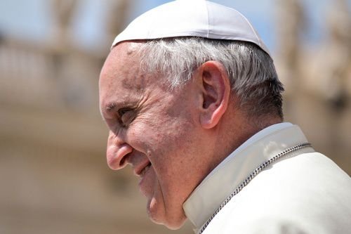 Pope Francis greets pilgrims in St. Peter's Square during his Wednesday general audience on June 18