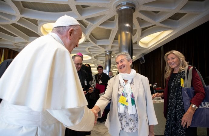 Pope Francis greets Sister Maria Luisa Berzosa Gonzalez before a session of the Synod of Bishops on young people