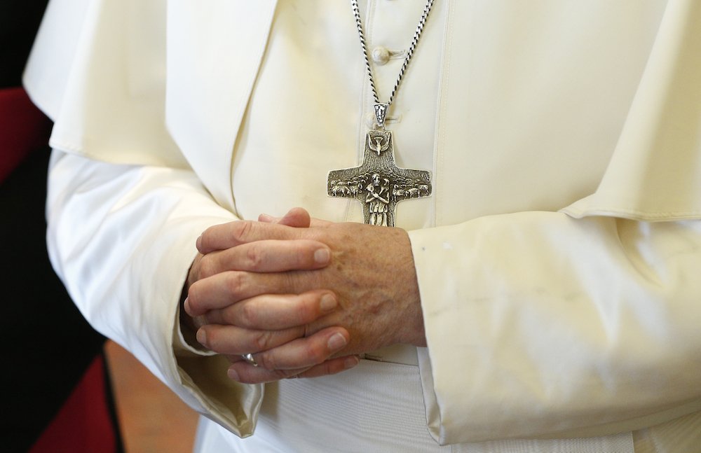 Pope Francis' pectoral cross is seen as he meets Viorica Dancila