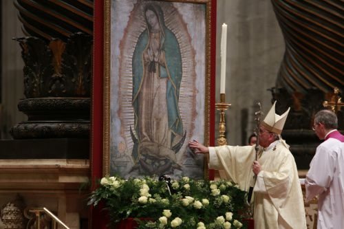 Pope Francis touches an image of Our Lady of Guadalupe at St. Peter's Basilica Dec. 12