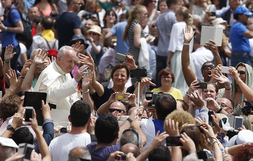 Pope Francis greets the crowd after celebrating a Mass for the Jubilee of Deacons in St. Peter’s Square at the Vatican May 29. The Mass was an event of the Holy Year of Mercy. (CNS photo/Paul Haring)