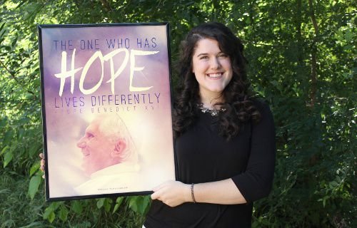 Cassie Pease stands with one of her designs. Courtesy of Cassie Pease.