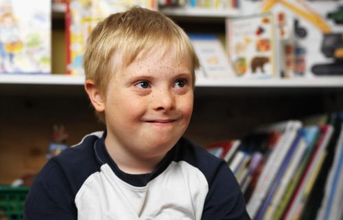 Boy with Down syndrome in a classroom. Credit: George Doyle/Stockbyte.
