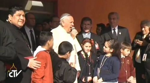 Pope Francis speaks with patients outside Asuncion's Ni√±os de Acosta √ëu pediatric hospital