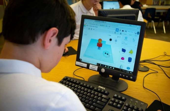 Ethan Gaylord works on the design of a prosthetic hand for underprivileged children. (Chaz Muth/CNS via Crux)