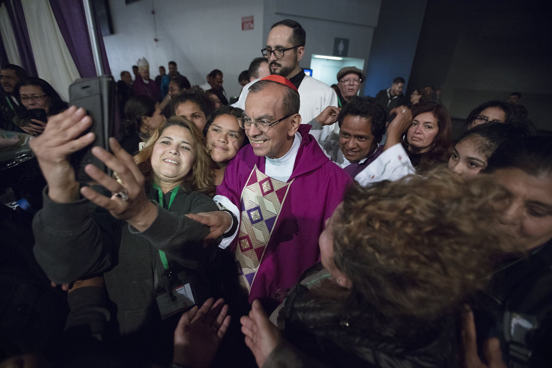 Auxiliary bishop of San Salvador Cardinal Gregorio Rosa Chavez greets massgoers at the 2018 Religious Education Congress in Anaheim