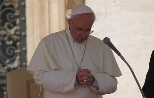 Pope Francis prays during his General Audience on Sept. 25