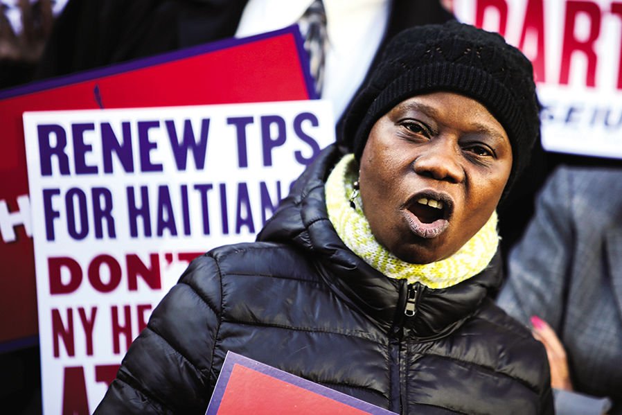 A woman participates in an immigration rally for Haitians last month in New York City. The Trump administration announced Nov. 20 that Haitians and others with Temporary Protected Status (TPS) must leave the U.S. by specified deadlines or face deportation. (CNS PHOTO/EDUARDO MUNOZ