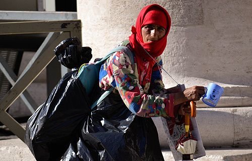 A gypsy begs in St. Peter's Square on June 4