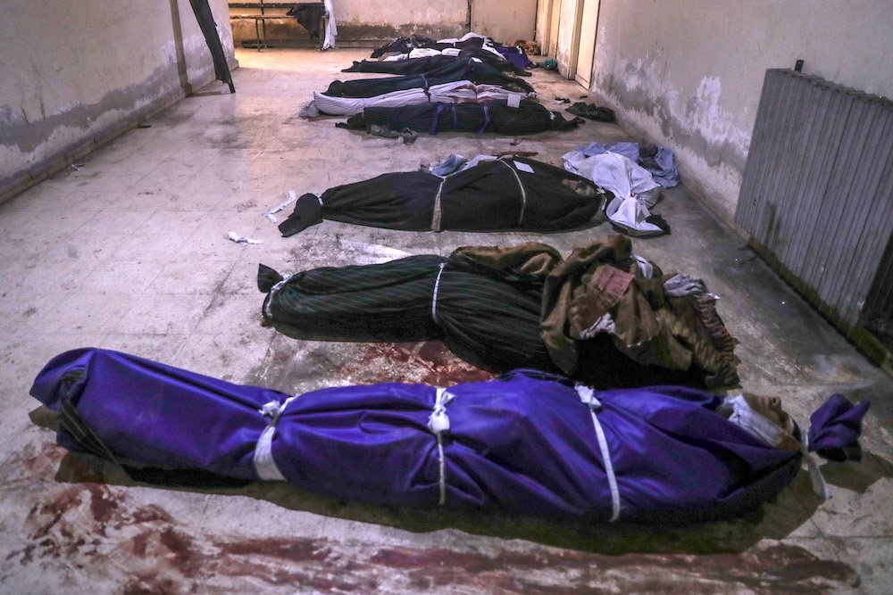 Bodies of people allegedly killed by Islamic State militants are seen on the floor of a morgue in late February in Douma