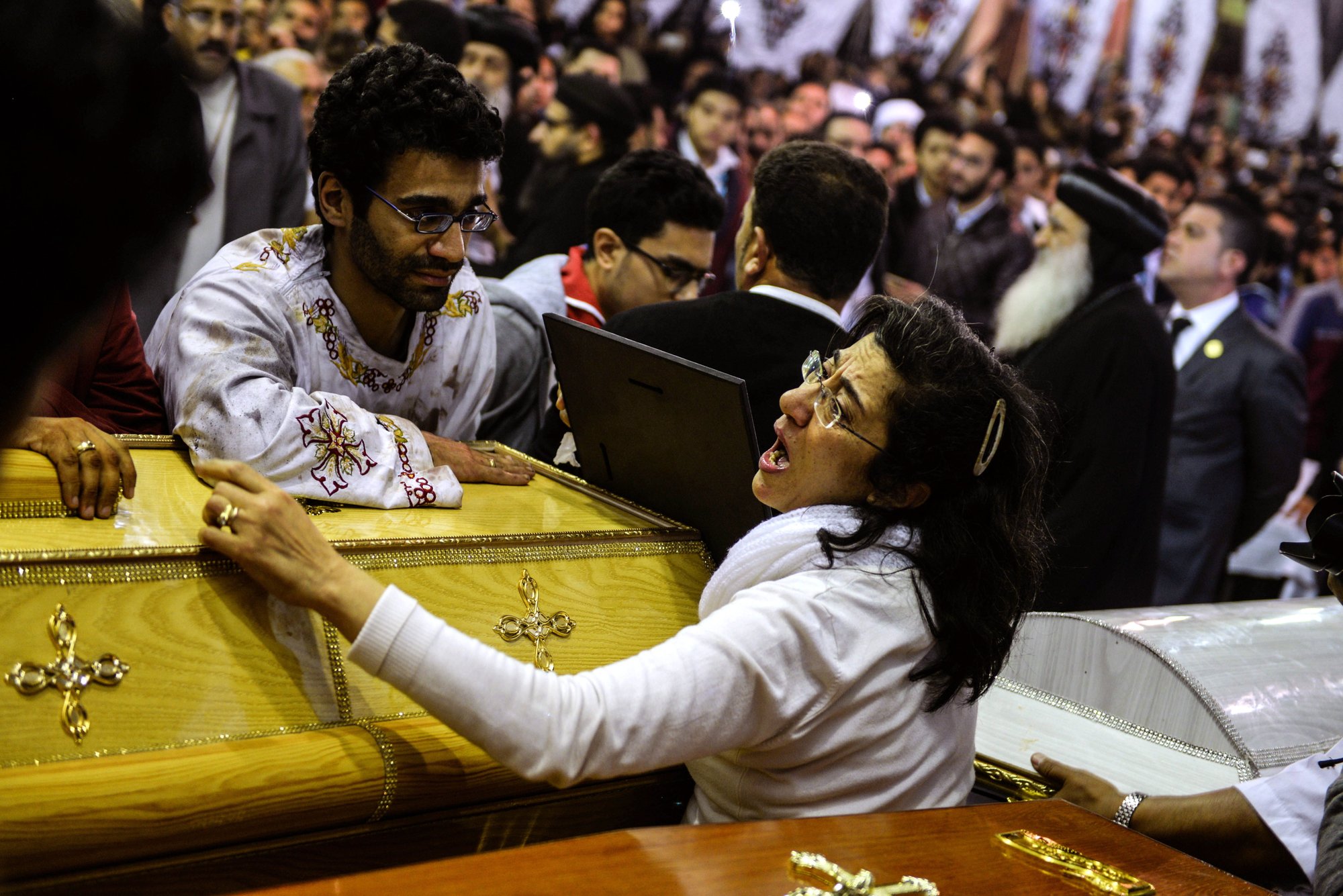 Mourners attend the April 10 funeral for victims of a bomb attack the previous day at the Orthodox Church of St. George in Tanta