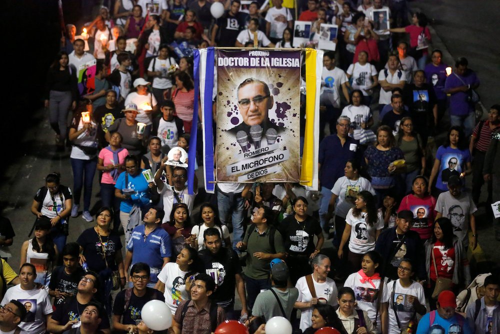 People carry a banner of St. Oscar Romero during an Oct. 13 procession in San Salvador