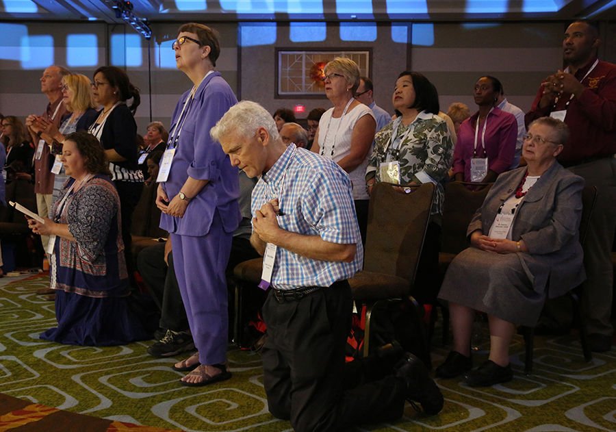 Attendees pray during the opening Mass of the “Convocation of Catholic Leaders: The Joy of the Gospel in America” July 1 in Orlando