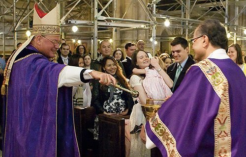 Cardinal Timoth Dolan blesses expectant mothers in St. Patrick's Cathedral in New York City on April 6