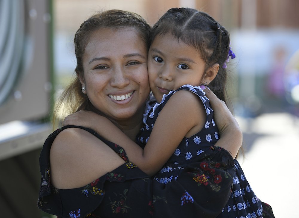 Miriam Mejia poses with her 3-year-old daughter