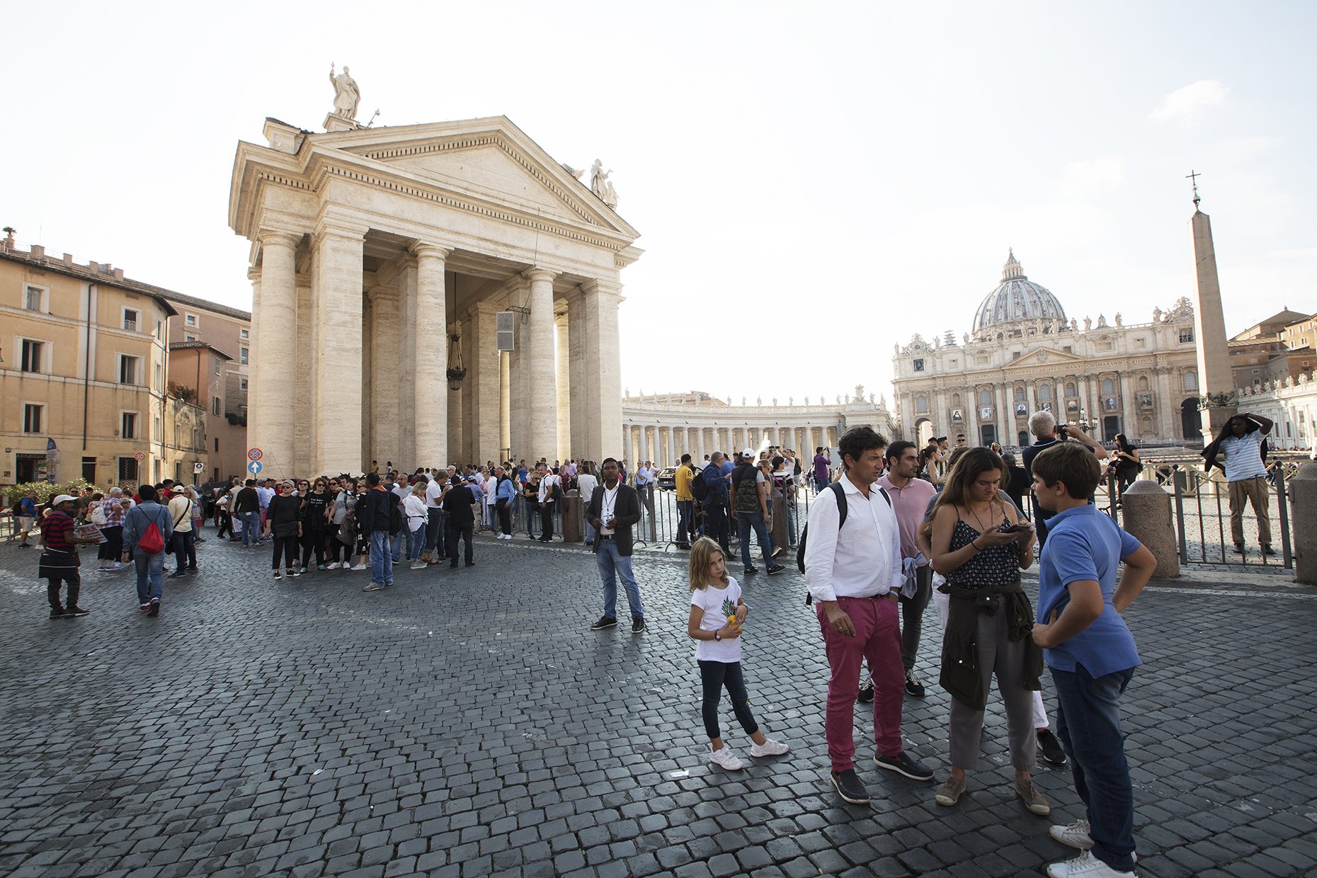 Pilgrims wait for the canonization of Oscar Romero in Rome during the 2018 Synod on Young People