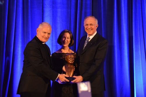 Fr. Arne Panula presents Carl and Dorian Anderson with the St. John Paul II Award for the New Evangelization in Washington