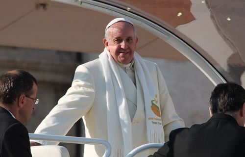 Pope Francis greets pilgrims in St. Peter's Square during the Wednesday general audience on Dec. 11