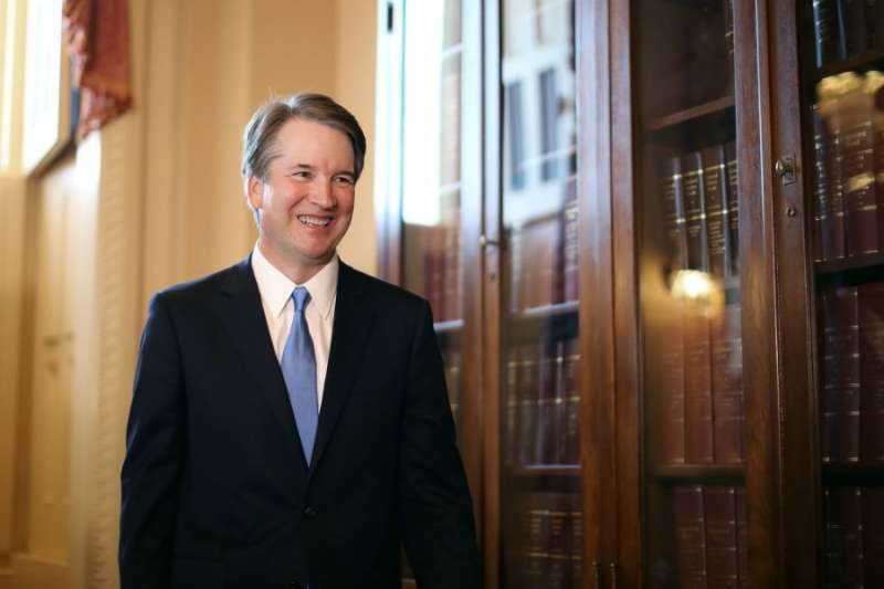 Judge Brett Kavanaugh leaves the room following a meeting with Senator Charles Grassley at the U.S. Capitol July 10