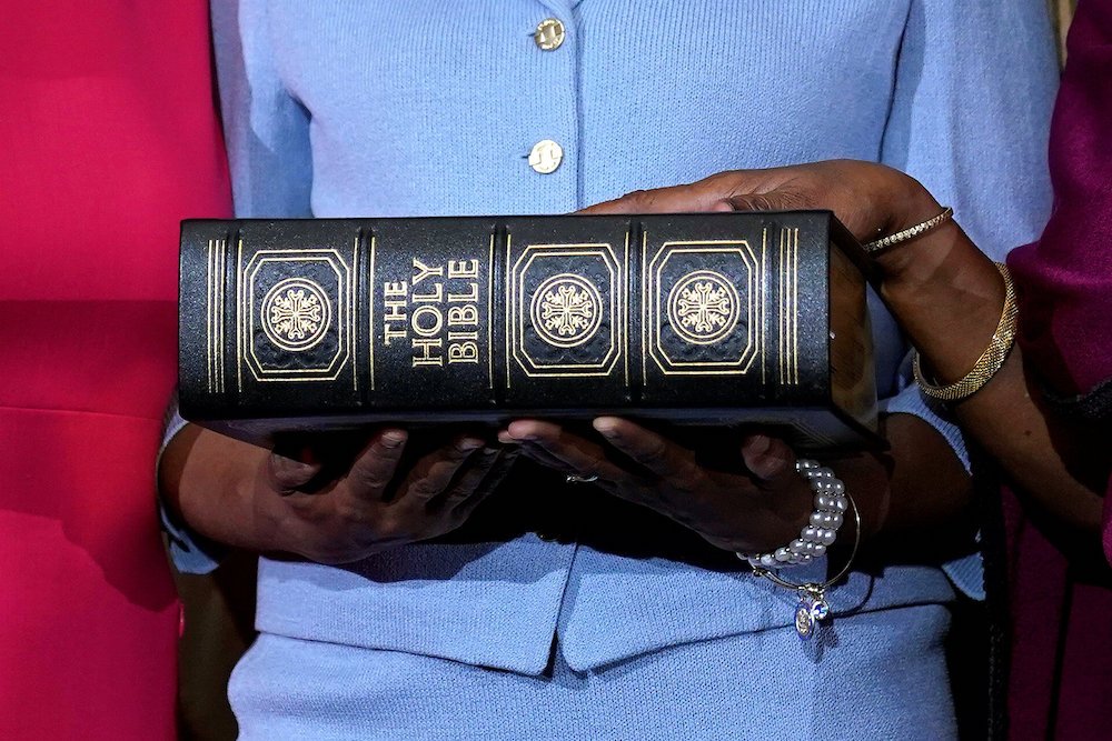Rep. Sheila Jackson Lee (D-Texas) poses with a Bible Jan. 3 for a ceremonial swearing-in picture on Capitol Hill in Washington. (CNS photo/Joshua Roberts