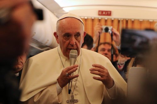 Pope Francis speaks to reporters aboard the papal flight to Armenia
