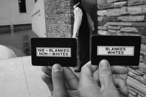 Passes received at the Apartheid Museum in Johannesburg. Credit: Francois de Halleux via Flickr (CC BY-NC-ND 2.0).