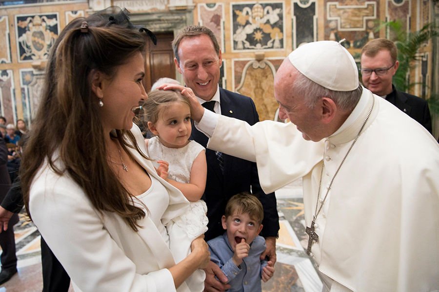 Pope Francis greets family members during an audience with participants in an international congress on protecting children in a digital world