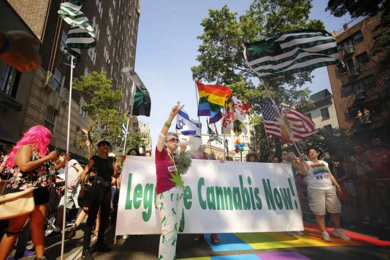 Demonstrators for the legalization of cannabis march in the New York Pride Parade