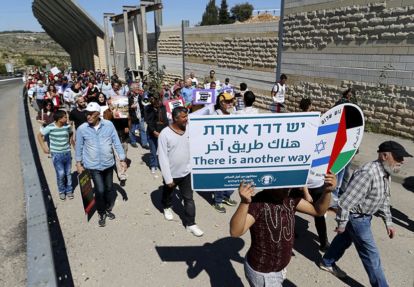 Israeli and Palestinian activists march April 1 during a Land Day protest Bethlehem